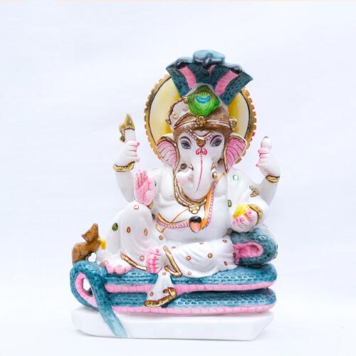 "Divine Marble Sculpture of Vighnaharta Ganesh Ji, Gracefully Seated Upon a Three-Mouthed Emerald Serpent"